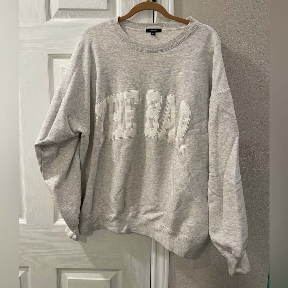 The Bar Varsity Crewneck Sweatshirt in grey, Size XL. Excellent condition.